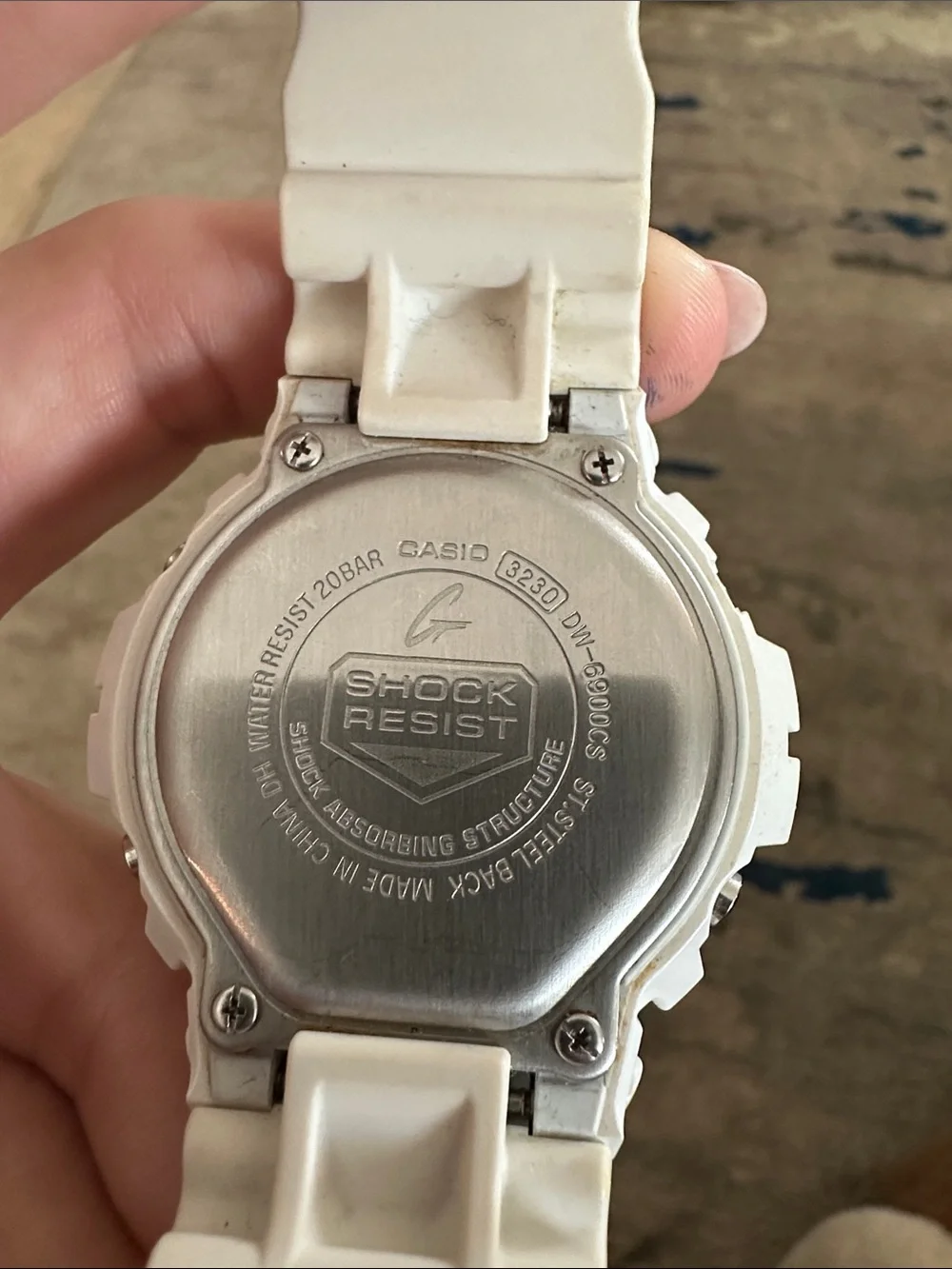 G-Shock White Watch with Blue and Green Accents